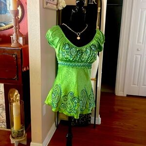 Satin chartreuse green with embroider blue design. Ties in the back